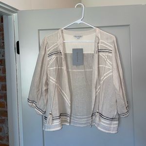 Women’s top size small with tassel detail, NWT, perfect condition